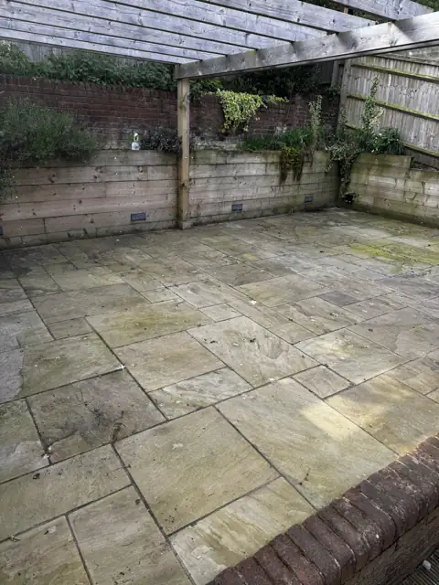 Indian sandstone patio clean in Kimpton, before cleaning by Renaco